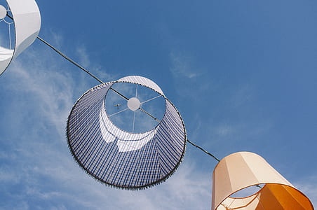 three white, brown, and gray hanged lampshades thumbnail