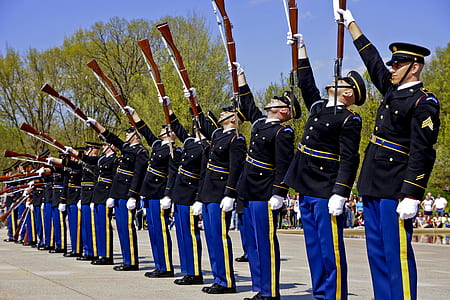men raising rifle during daytime thumbnail
