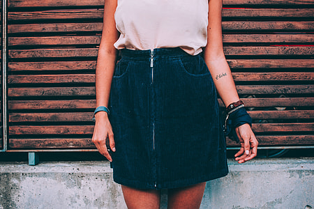 Image of a girl wearing a blue dress and white top thumbnail