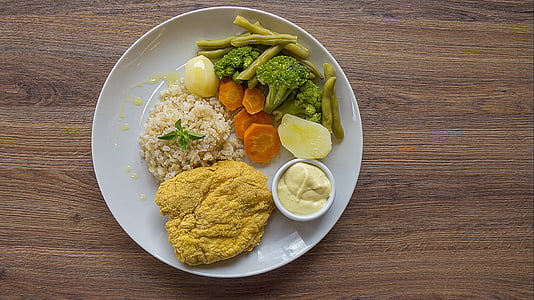 rice dish with fried meat, broccoli, beans and sliced carrots thumbnail