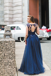woman wearing blue dress looking to the left during daytime thumbnail