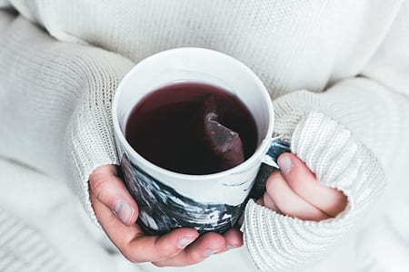 person holding cup of coffee thumbnail