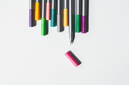 top view photography of assorted pen lot thumbnail