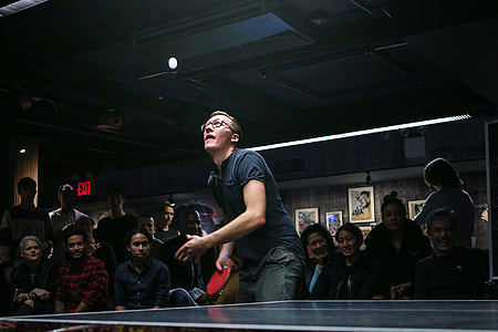 people watching man playing table tennis thumbnail
