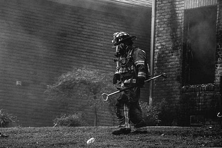 grayscale photography of man wearing firesuit thumbnail