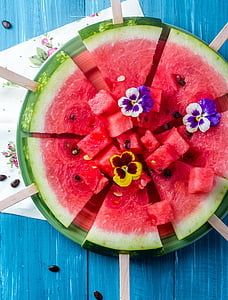 slice watermelon with yellow petal flower thumbnail