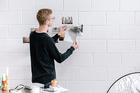 man holding paper thumbnail
