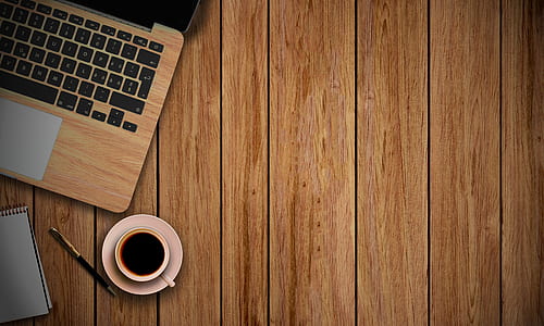 white teacup on white saucer near laptop thumbnail