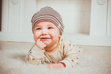 baby with finger in mouth thumbnail