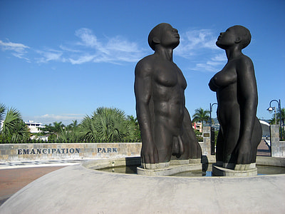 Statues of man and women in Kingston, Jamaica thumbnail