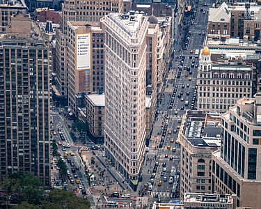 high-rise white and brown concrete building at daytim thumbnail