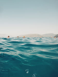 people in body of water during daytime thumbnail