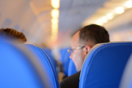 person sitting on blue chair thumbnail