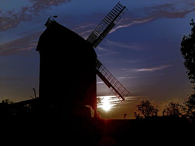 silhouette of windmill beside trees thumbnail