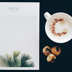 Having cappuccino while reading a magazine thumbnail