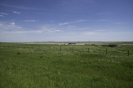Grassland, Farm, and skies landscape in Alberta thumbnail