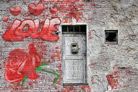 gray concrete wall with red love text graffiti thumbnail