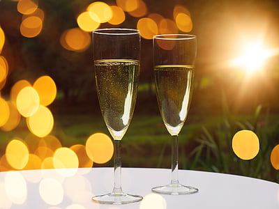 two clear wine glasses on top of table in shallow focus photography thumbnail