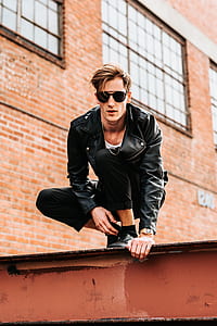 man wearing black leather jacket and pants thumbnail