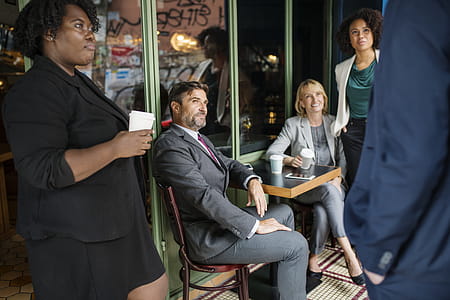 Man Facing Three Women and Man thumbnail