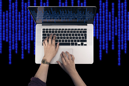 person touching MacBook Pro turned on thumbnail