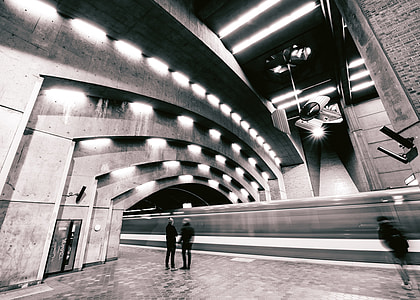 grayscale photo of two man in terminal thumbnail