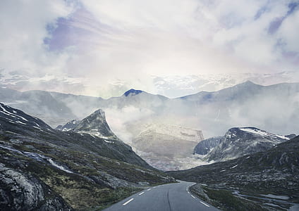 snow-covered mountain beside gray concrete road thumbnail