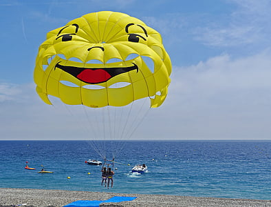 two person ride on parachute over body of water thumbnail