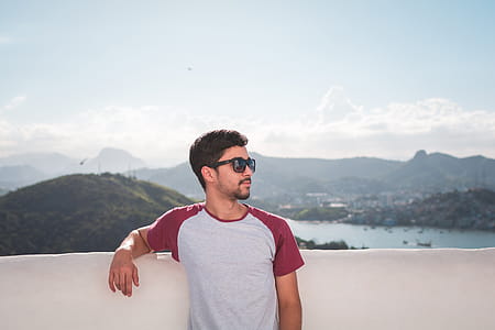 Man in White and Red Crew-neck T-shirt in Shallow Focus Photography thumbnail
