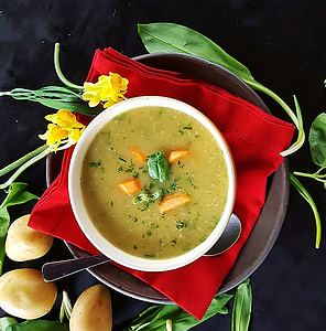 bowl with soup on top of red towel thumbnail