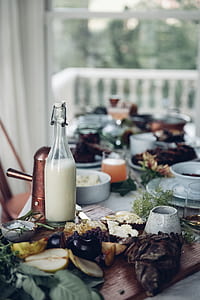 half filled milk glass bottle on table thumbnail