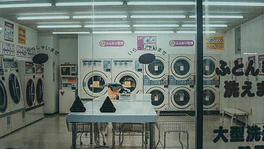 laundromat can be seen through clear glass wall thumbnail
