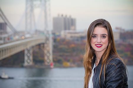 woman wearing black jacket taking selfie thumbnail