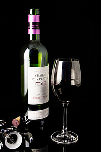 Chateau Bots Pertun bottle besides wing glass thumbnail