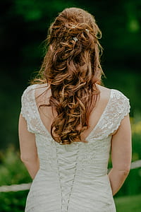 woman wearing open-back sleeveless dress thumbnail