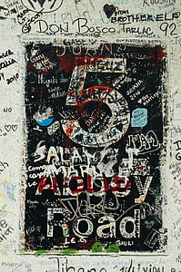 white wall full of grafitti thumbnail