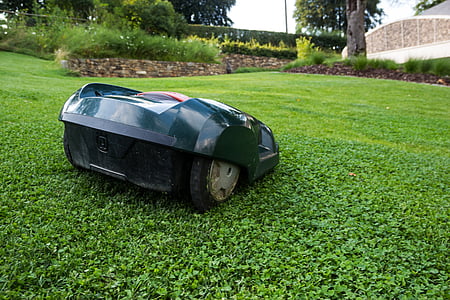 black robot mower on grass thumbnail