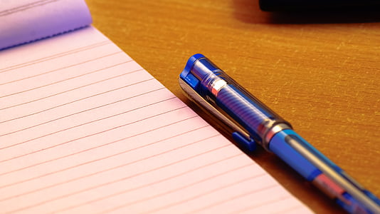 blue ballpoint pen beside white ruled-paper thumbnail