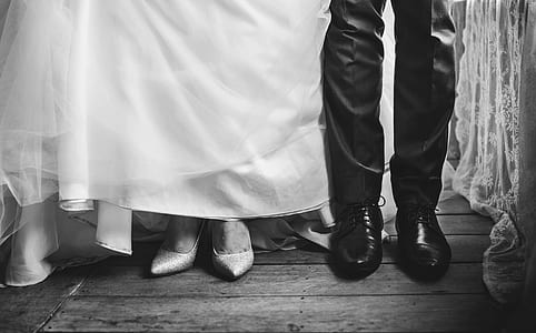 grayscale photo of bride and groom feet thumbnail