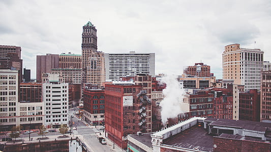 brown and white concrete buildings at daytime thumbnail