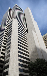 low-angle photography of gray concrete building thumbnail