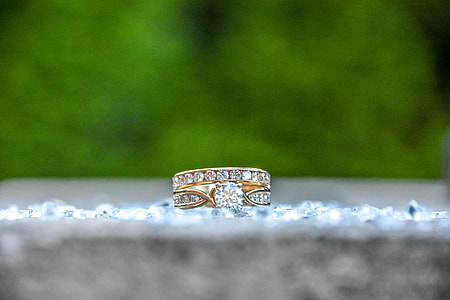 gold-colored ring on gray floor thumbnail