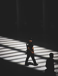 police man walking on road thumbnail