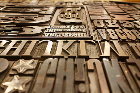 letters embossed brown wooden panel thumbnail