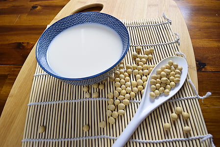 spoon of soya bean near blue bowl thumbnail