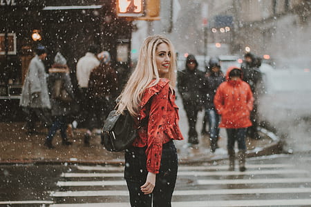 woman standing on pedestrian lane thumbnail