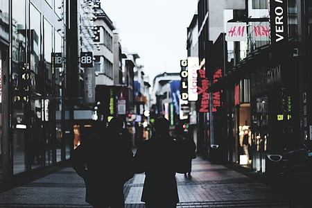 silhouette of people walking on street thumbnail