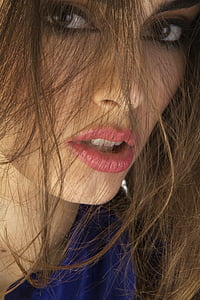 woman wearing royal-blue top thumbnail