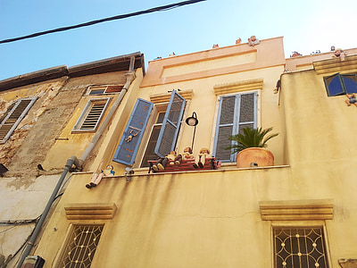 worm's eye view of brown house during daytime thumbnail