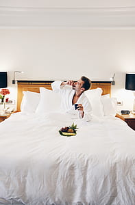 man eating fruits on bed thumbnail